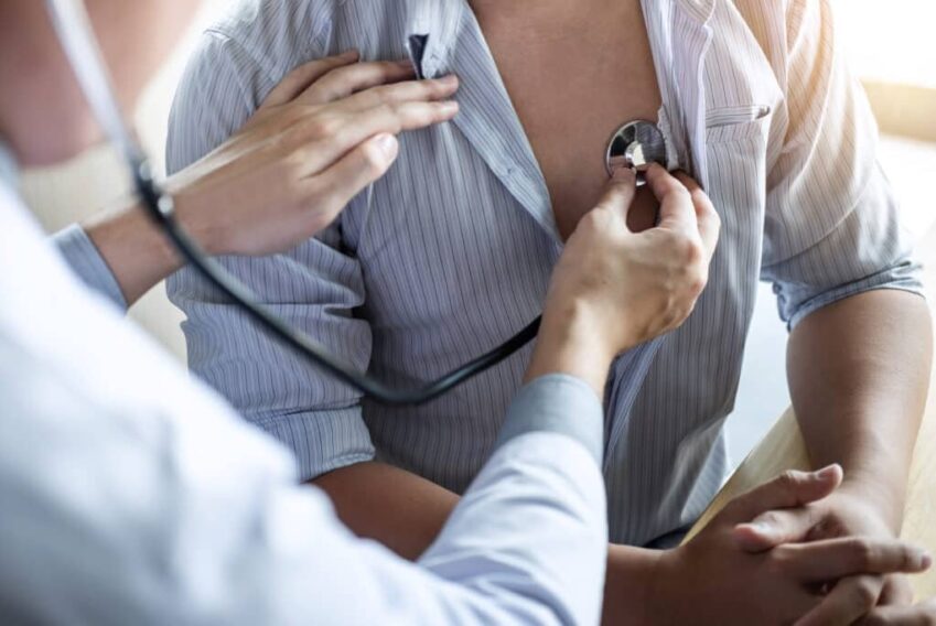 Doctor using a stethoscope checking patient with examining, pres