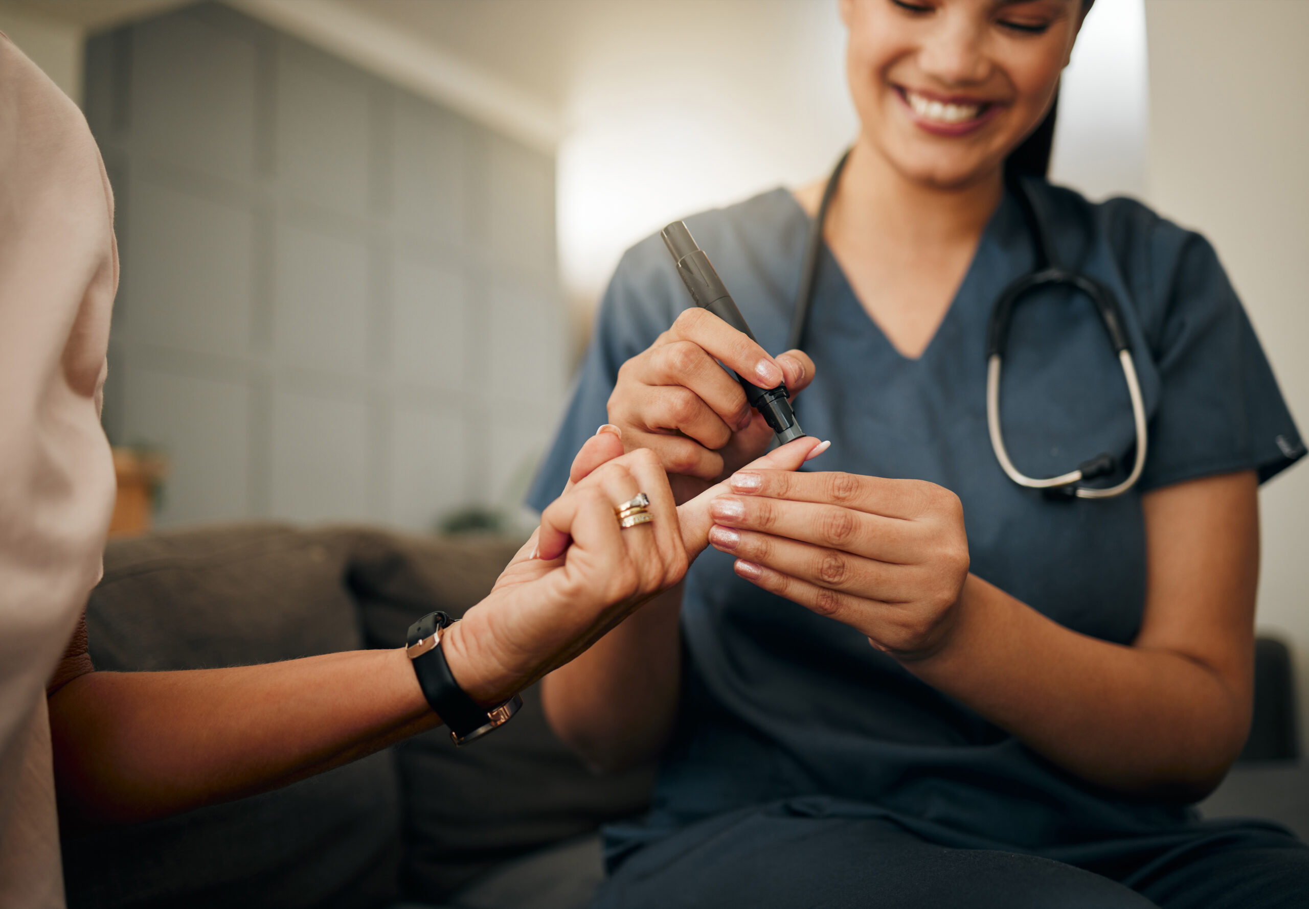 Zoom of doctor, diabetes or elderly woman hands with blood test, sugar or medical test with a glucometer. Healthcare, health nurse or diabetic lady consulting on glucose wellness in living room Zoom of doctor, diabetes or elderly woman hands with blood test, sugar or medical test with a glucometer. Healthcare, health nurse or diabetic lady consulting on glucose wellness in living room